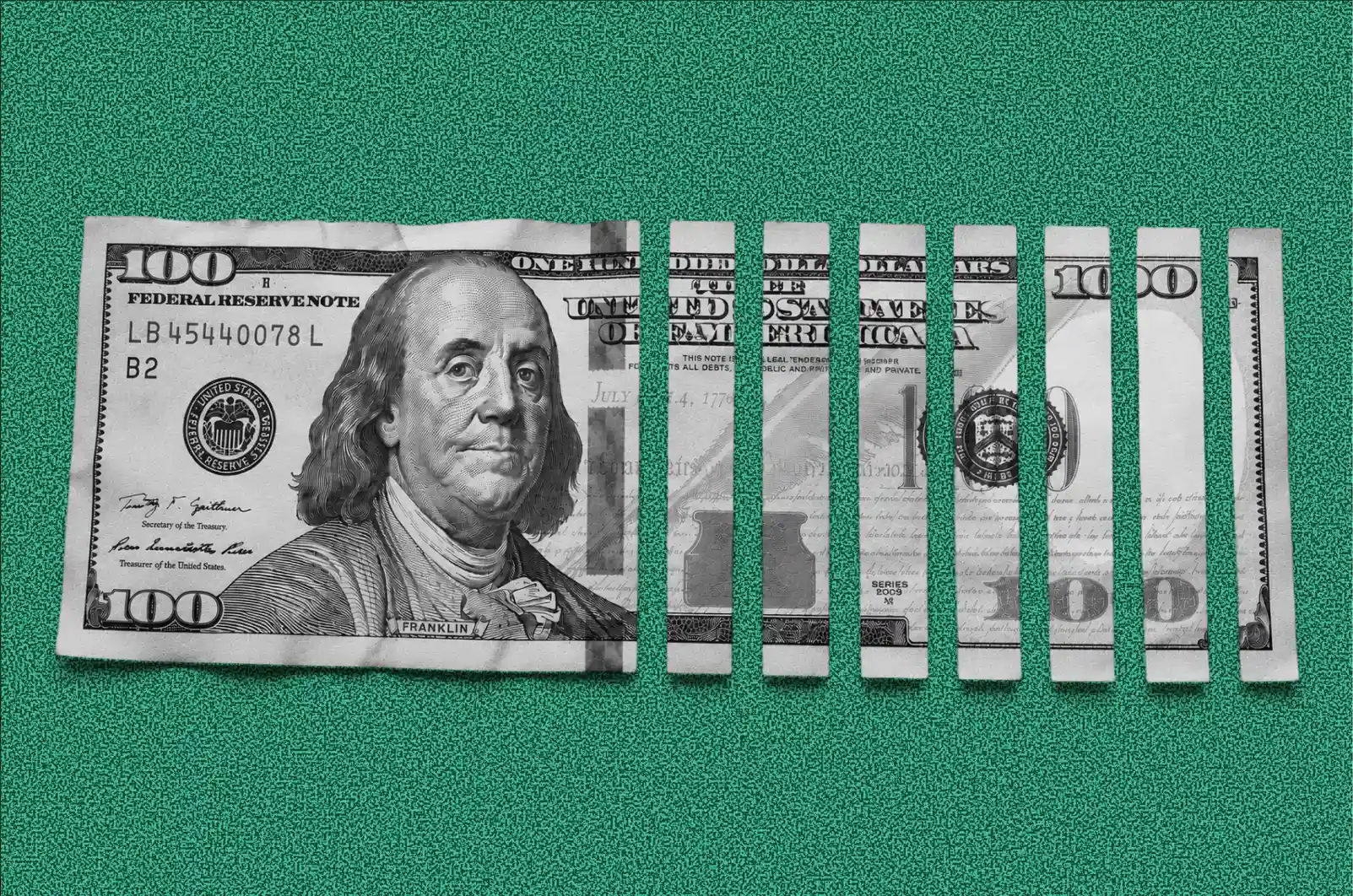 Half-shredded hundred-dollar bill illustrating the cost of choosing the wrong design firm